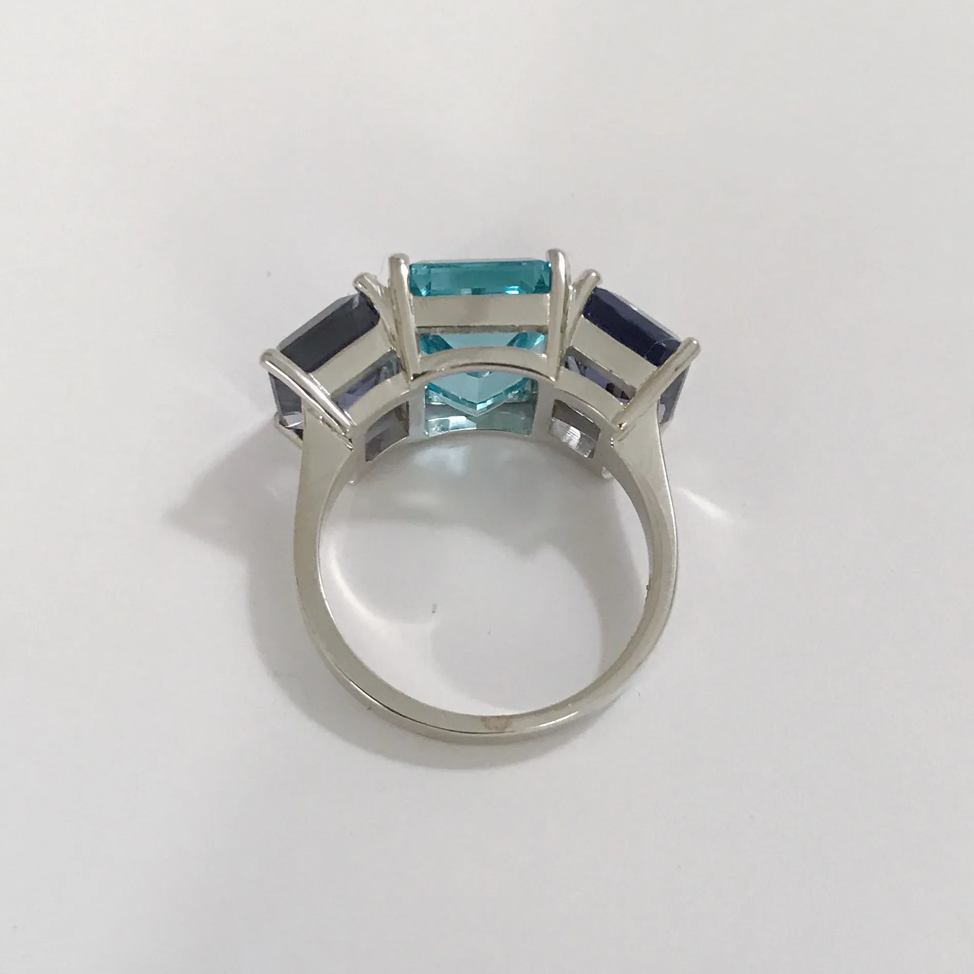 18kt White Gold Three Stone Emerald Cut Ring with Blue Topaz and Iolite